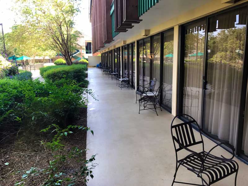 Magnolia Poolside Rooms - Looking down the Poolside patios