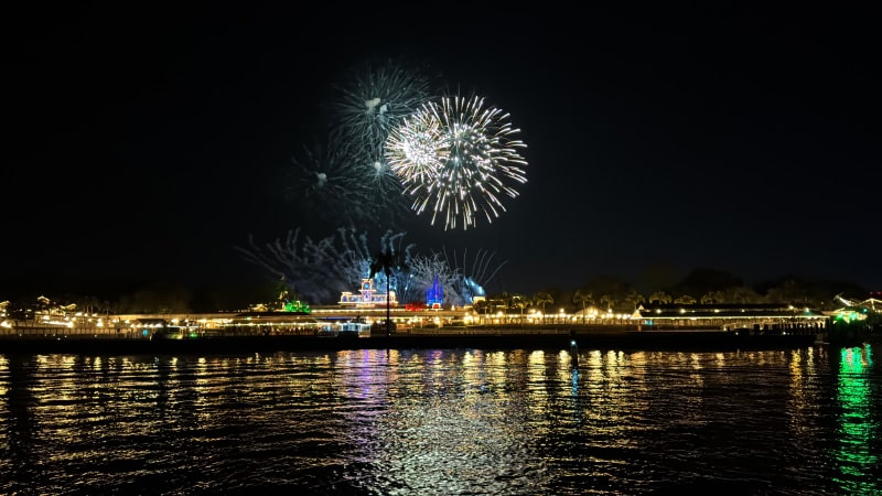 Happily Ever After fireworks reflecting on Seven Seas Lagoon during our fireworks cruise