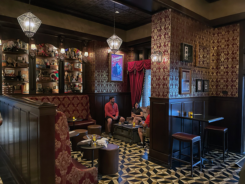 Cozy antique-style seating inside AbracadaBar