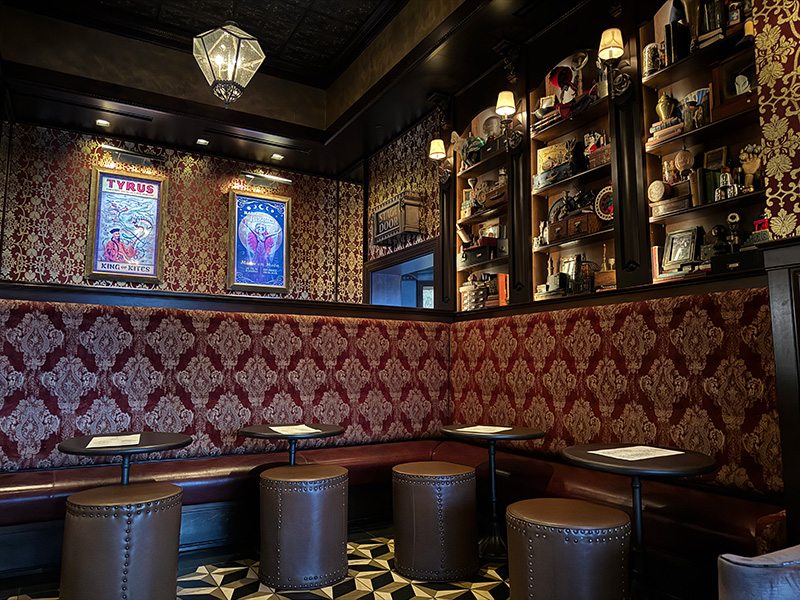 Antique-style lounge seating inside AbracadaBar