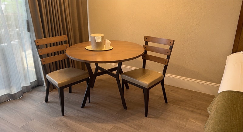 Table and chairs inside a Shades of Green guest room